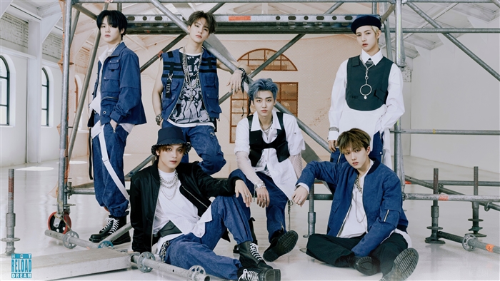 NCT Dream members posing on scaffolding