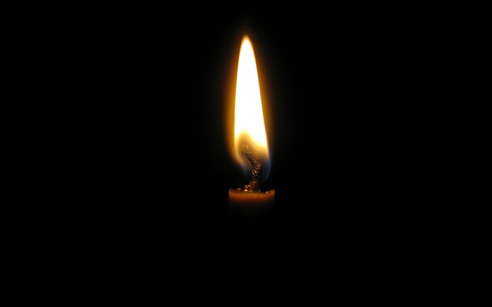 Close-up of a candle flame on a black background