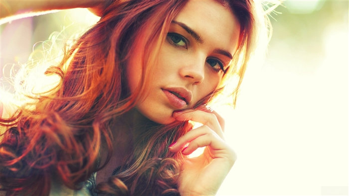 Woman with red hair in sunlight 4K