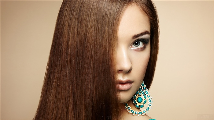 Woman with brown hair and blue eyes wearing earrings 4K