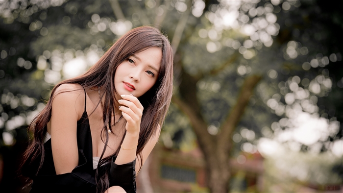 Brunette Woman with Soft Bokeh in Nature