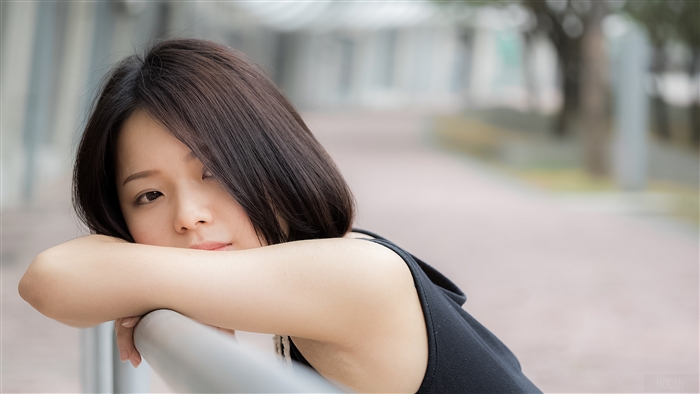 Young woman resting her head on her arms