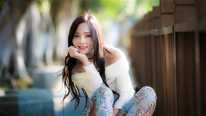 Smiling Asian Woman with Long Hair in Soft Light 4K