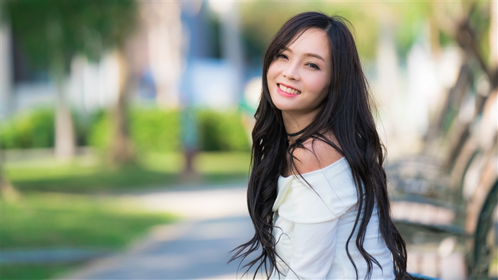 Smiling Woman with Long Brunette Hair Outdoors 4K