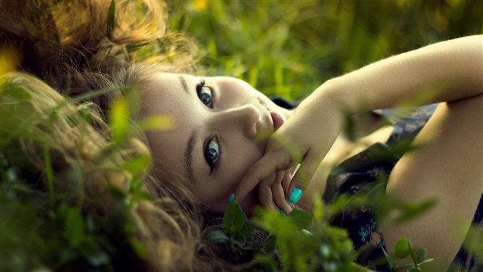Girl lying in grass 4K