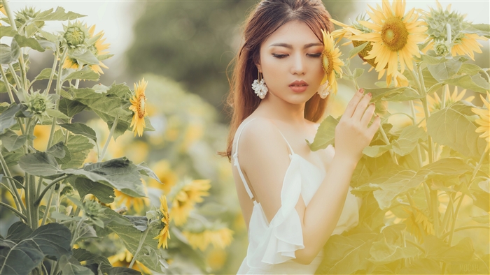 Woman in White Dress Among Sunflowers
