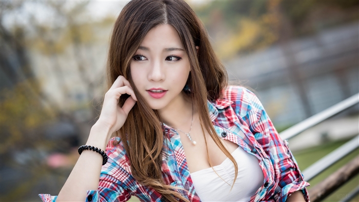 Thoughtful Brunette Woman With Depth of Field Effect