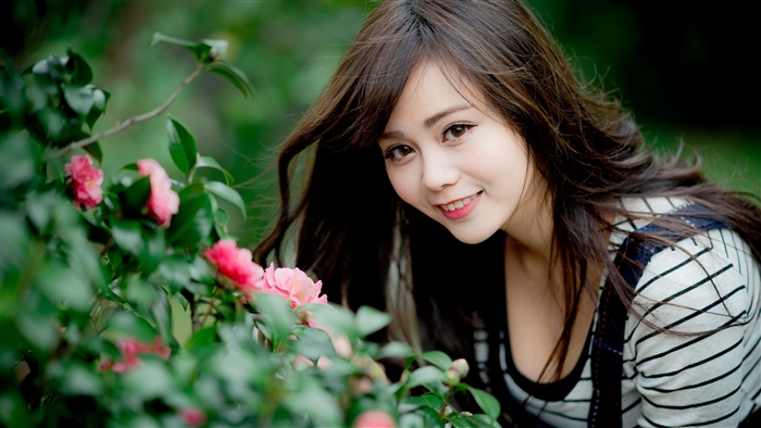 Smiling Brunette Girl with Pink Flowers 4K