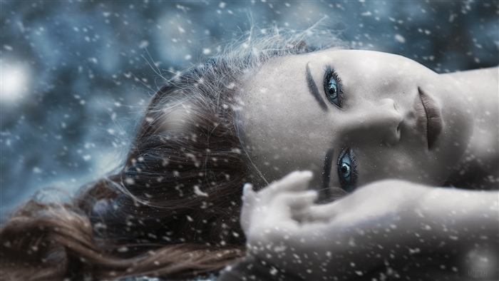 Woman with blue eyes in snow 4K