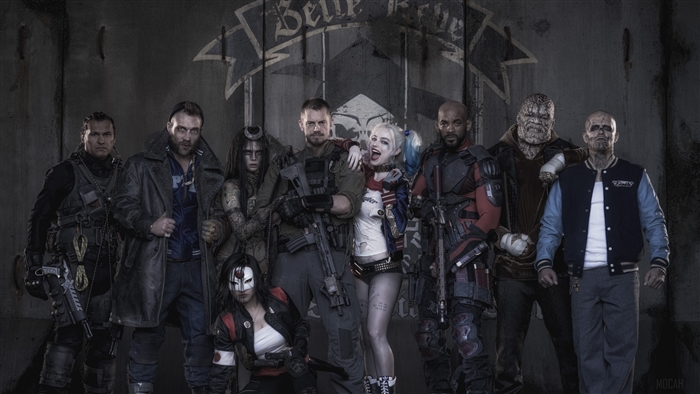 Suicide Squad characters in front of a wall