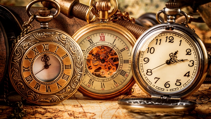 Three pocket watches on a map