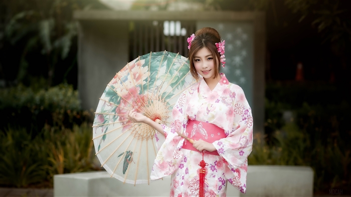 Woman in Kimono holding an umbrella