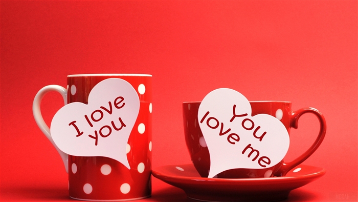 Two red polka dot cups with heart-shaped notes