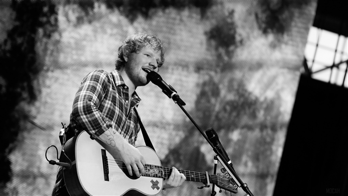 Ed Sheeran performing live with guitar