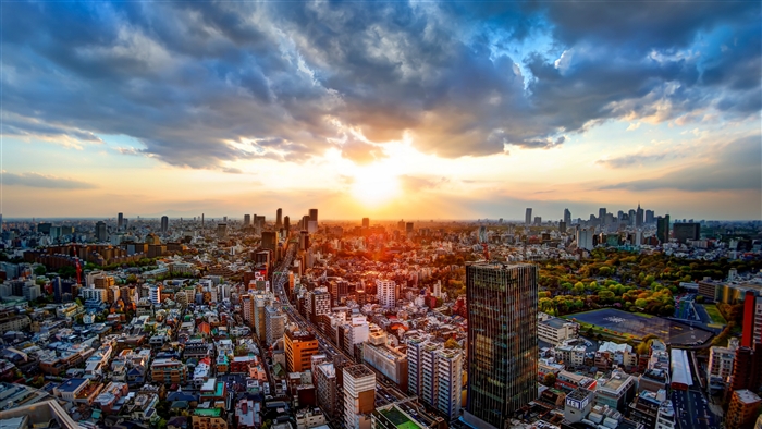 Sunset over Tokyo cityscape with skyscrapers and clouds