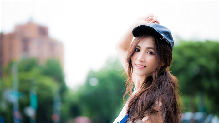 Woman wearing a cap and smiling