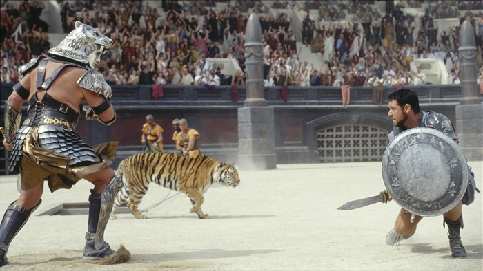 Gladiator fighting a tiger in an arena