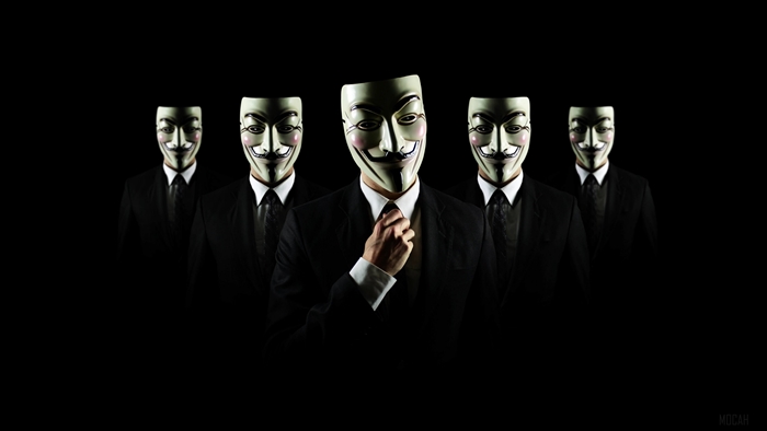 Group of people wearing Guy Fawkes masks