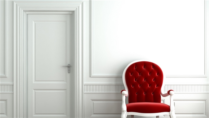 Red armchair next to a white door