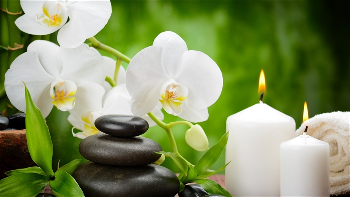 Serene Spa Setting with White Orchid and Candles
