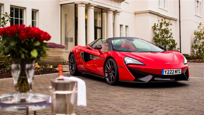 Red McLaren 570S Spider Supercar in Front of Home