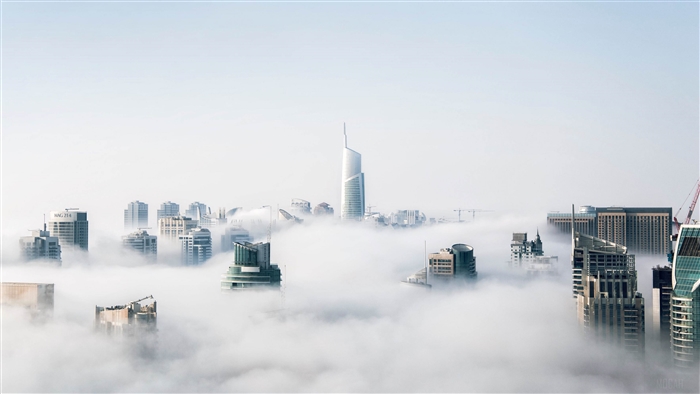 Dubai skyscrapers emerging from fog 4K