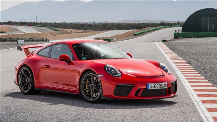 Red Porsche 911 GT3 on a Race Track