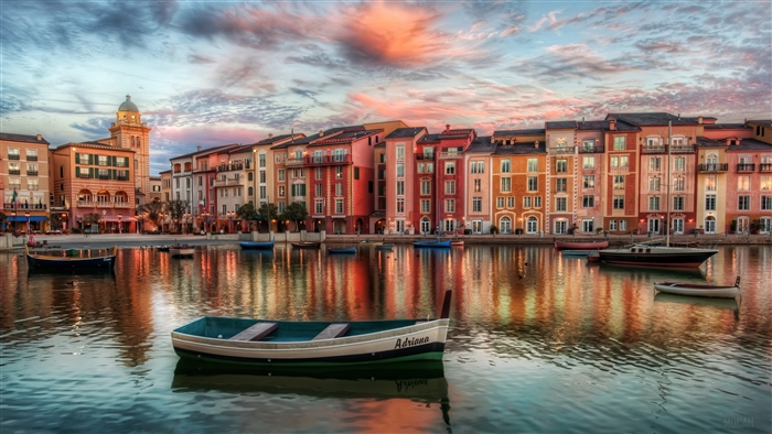 Colorful Buildings and Boats on Water at Sunset