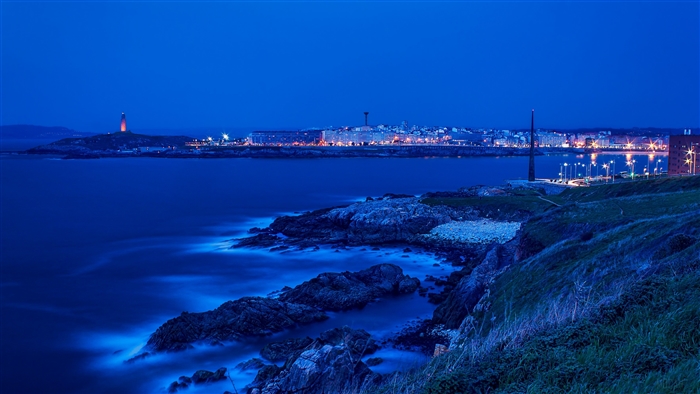Cityscape and Lighthouse at Dusk