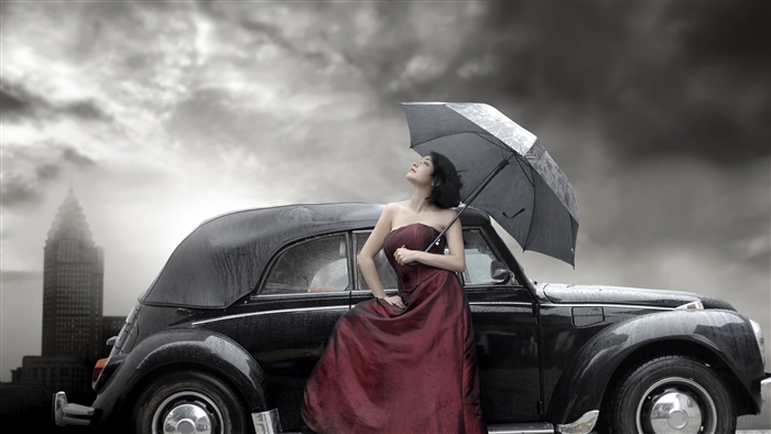 Woman with umbrella and vintage car in Gothic city