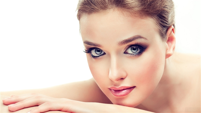 Elegant Woman with Striking Blue Eyes and Makeup