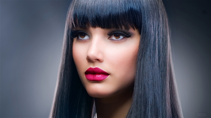 4K Portrait of Woman with Dark Hair and Bold Makeup