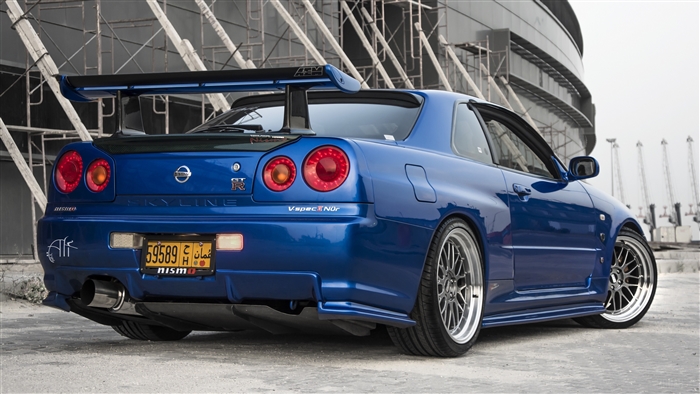 Blue Nissan Skyline GT-R V-Spec Nür with large spoiler