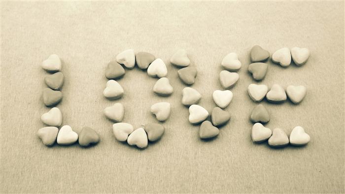 Love spelled with heart-shaped candies