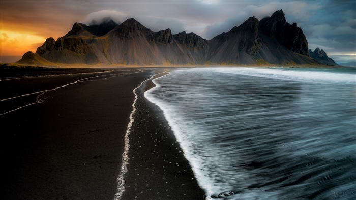 Black Sand Beach with Jagged Mountains in Iceland 4K