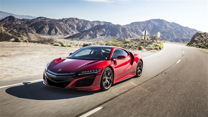 Red Acura NSX driving on a desert road
