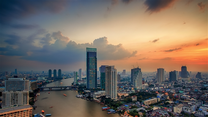 Bangkok cityscape with river and skyscrapers at sunset 4K