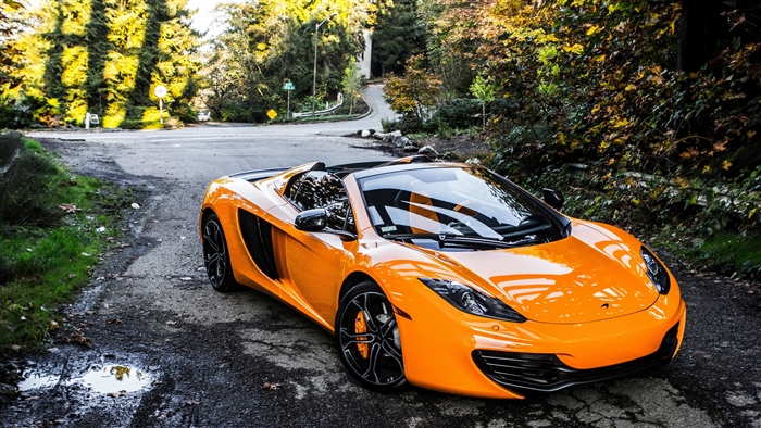 Orange McLaren MP4-12C Supercar on Forest Road