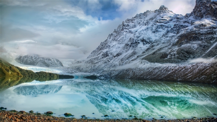 Snow-capped Andes mountains reflected in a lake, Argentina 4K