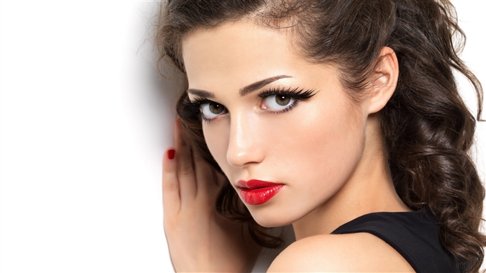 Woman with red lipstick and dramatic eyelashes