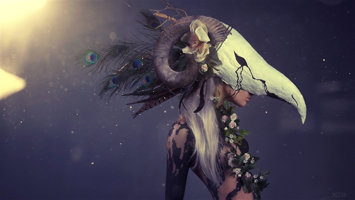 Woman with Ram Skull Headdress and Peacock Feathers