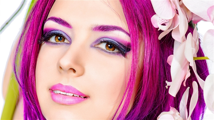 Woman with Crimson Hair and Purple Makeup with Flowers