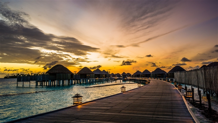 Overwater bungalows at Constance Halaveli Resort, Maldives at sunrise