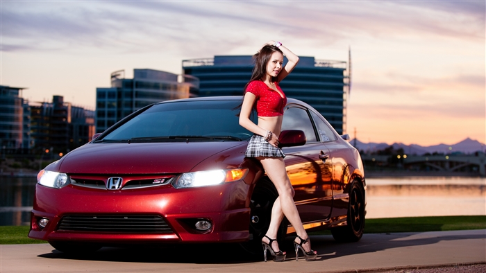 Woman posing with red Honda Civic Si
