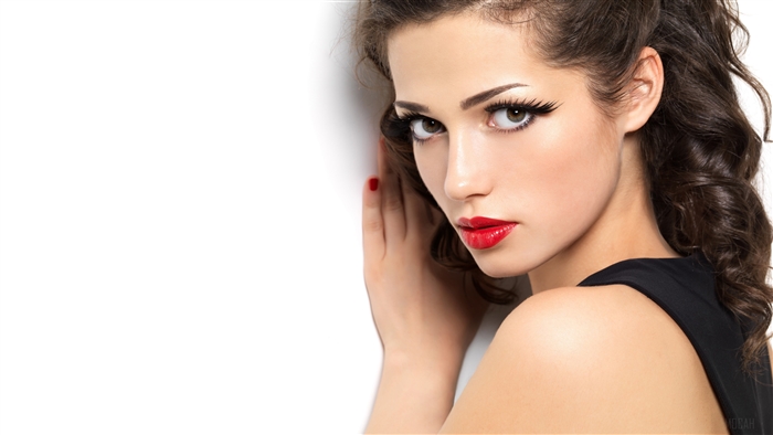 Woman with red lipstick and dramatic eyelashes