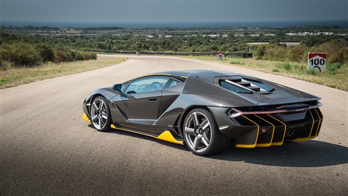 Lamborghini Centenario on a road with speed limit signs