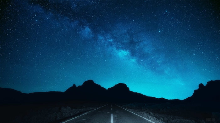 Milky Way over a dark mountain road 4K