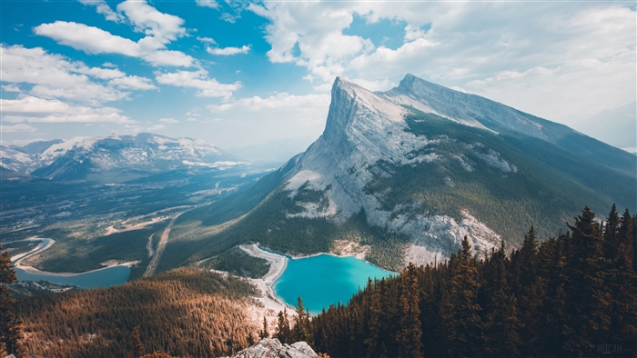 Mountain landscape with turquoise lake and forest