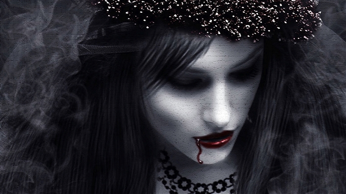 Gothic woman with blood dripping from lips