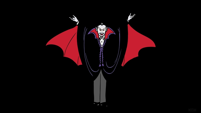 Vampire in a black cape with red lining